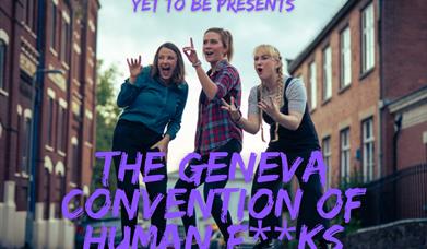 The Geneva Convention of Human F**ks team standing in a street.