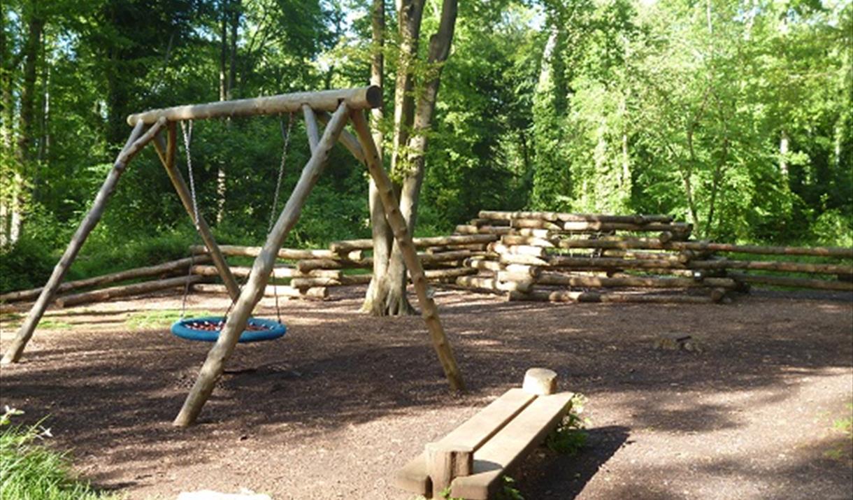 Swings and wooden bench