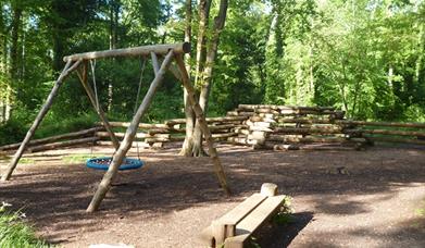 Swings and wooden bench