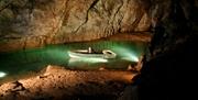 Wookey Hole cave with lake and boat