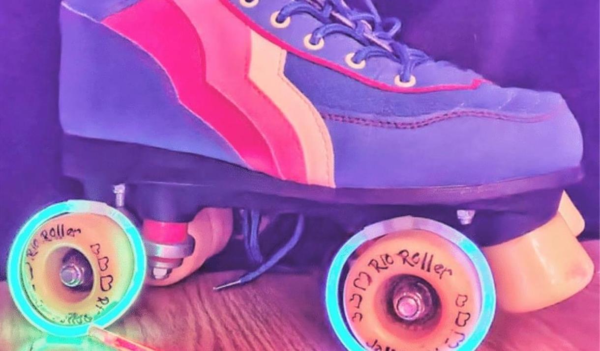 Roller disco boot in bright colours with details of the event.