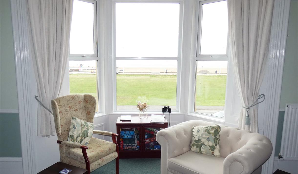 View from the bay window over the beach lawns to the beach