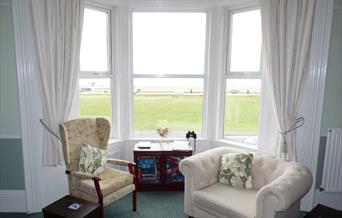 View from the bay window over the beach lawns to the beach