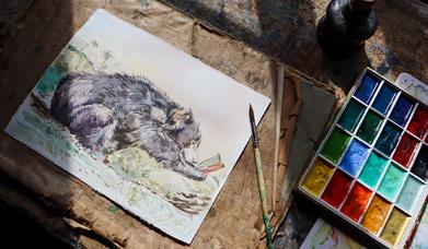 A watercolour painting of a brown bear