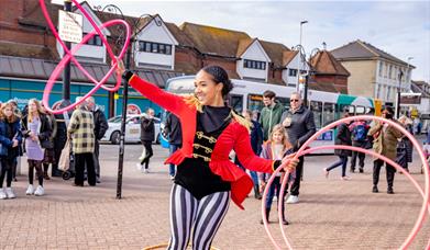 Image of Xena Flame performing her Hula Hoop act