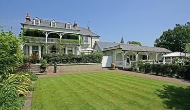 A cut lawn looking out towards Wingrove House.