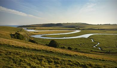 river winding through green hills