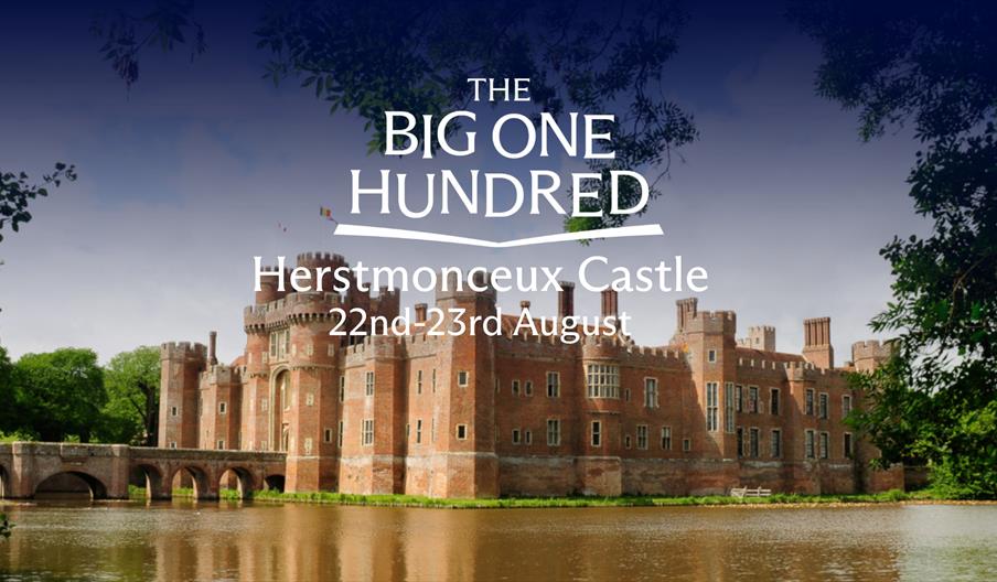 Herstmonceux Castle reflected in the moat, surrounded by greenery, with “The Big One Hundred – Herstmonceux Castle 22nd–23rd August” text overlaid.
