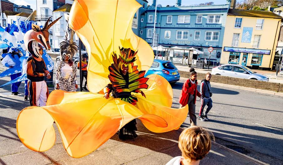 A group of street carnival artists in the street