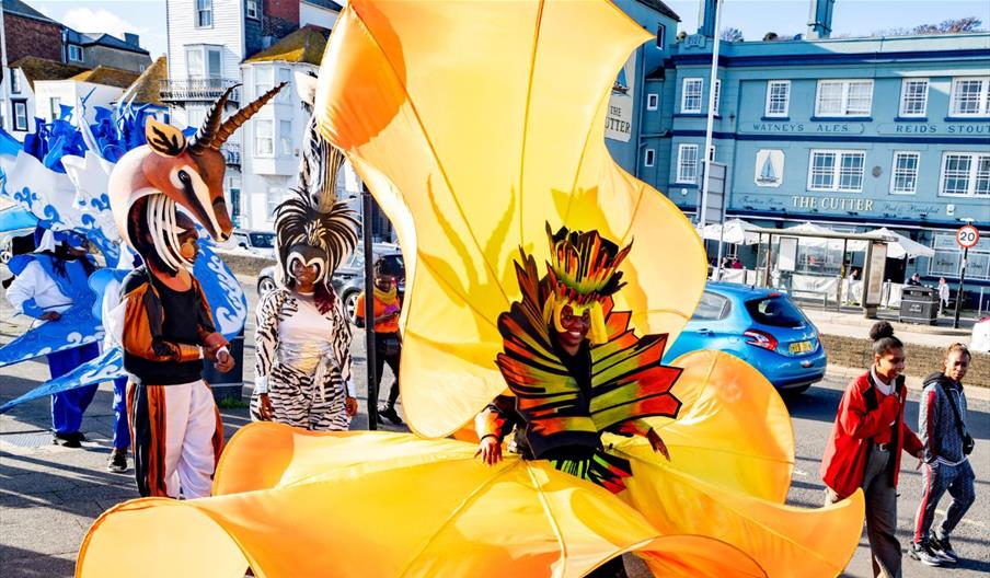 A group of street carnival artists in the street