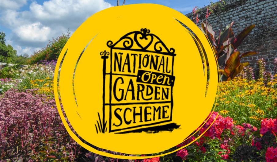 Bright summer garden in full bloom with a yellow National Garden Scheme logo overlaid in the centre against a blue sky.