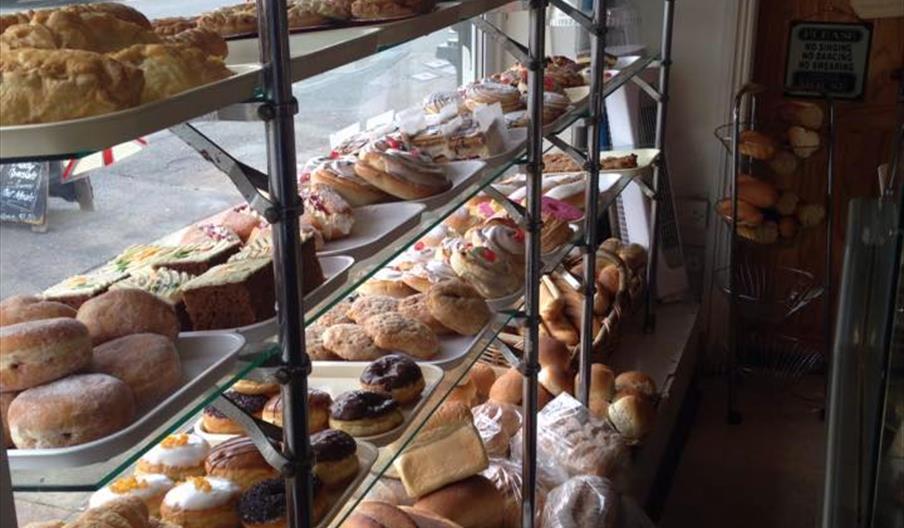 Bread and cakes displayed in window