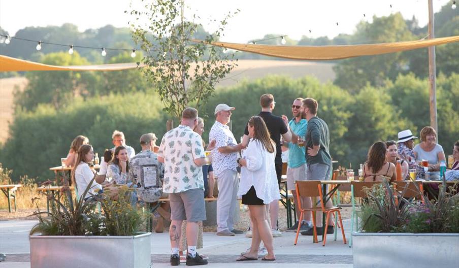 Group of people in the Gun Brewery outdoor seating