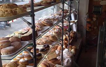 Bread and cakes displayed in window