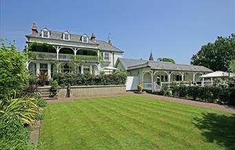 A cut lawn looking out towards Wingrove House.