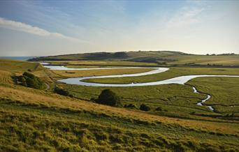 river winding through green hills