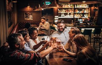 Friends enjoying drinks in the pub