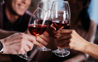 Friends sharing a glass of wine