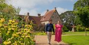 Image of a couple walking the gardens of Michelham Priory
