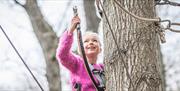 Girl in tree at Branching Out