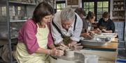 Clay Studio people making pottery