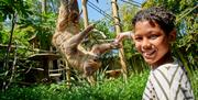 boy with sloth at Drusillas