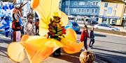 A group of street carnival artists in the street