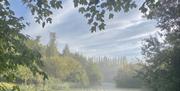 Image of the lake at Coe's Farm with mist