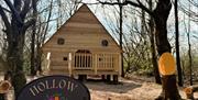 The hut called the 'Hollow Hideout' in the middle of a wooded area