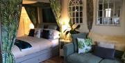 bedroom with king size bed and sofa bed