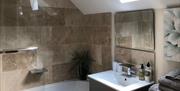 bathroom with bath/shower and tap