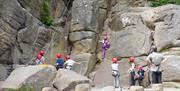 Group of people climbing Bowles Rock