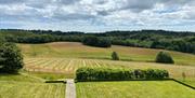 Image of the cherry picker and Vineyard fields in Coe's Farm