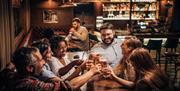 Friends enjoying drinks in the pub