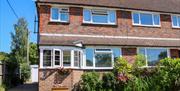semi-detached house with driveway and small garden out the front