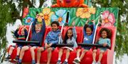 Image of kids on a ride at Drusillas Park