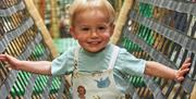 A image of a kid playing in the indoor play area at Drusillas Park