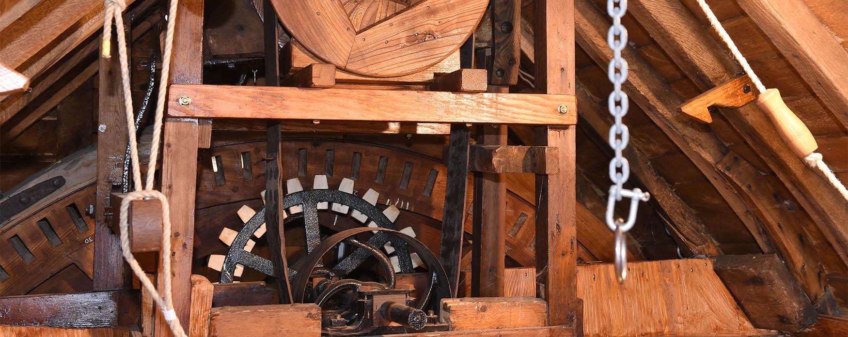 the wheels and mechanics of a windmill