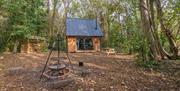 Alfriston Wood Cabins exterior shot with bbq