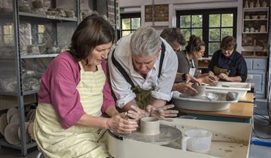 Clay Studio people making pottery