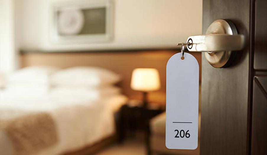 Hotel room with key in door