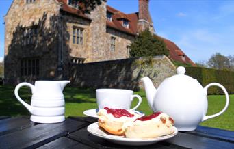 Michelham Priory exterior with cream tea