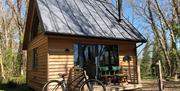 Alfriston Wood Cabins exterior shot with bike