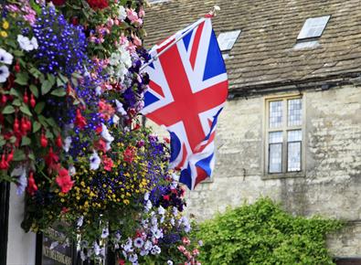 village with union jack flag and flowers