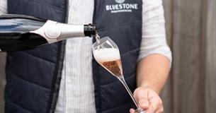 Bluestone sparkling rosé being poured into a glass