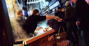 Food being served at a Christmas market stall