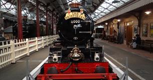 front of steam engine at STEAM museum of the Great Western Railway