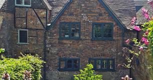 old brick house with formal garden
