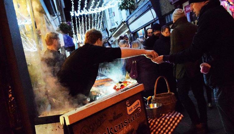 Food being served at a Christmas market stall