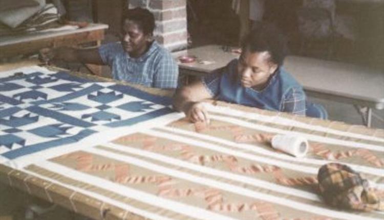 Women making quilts